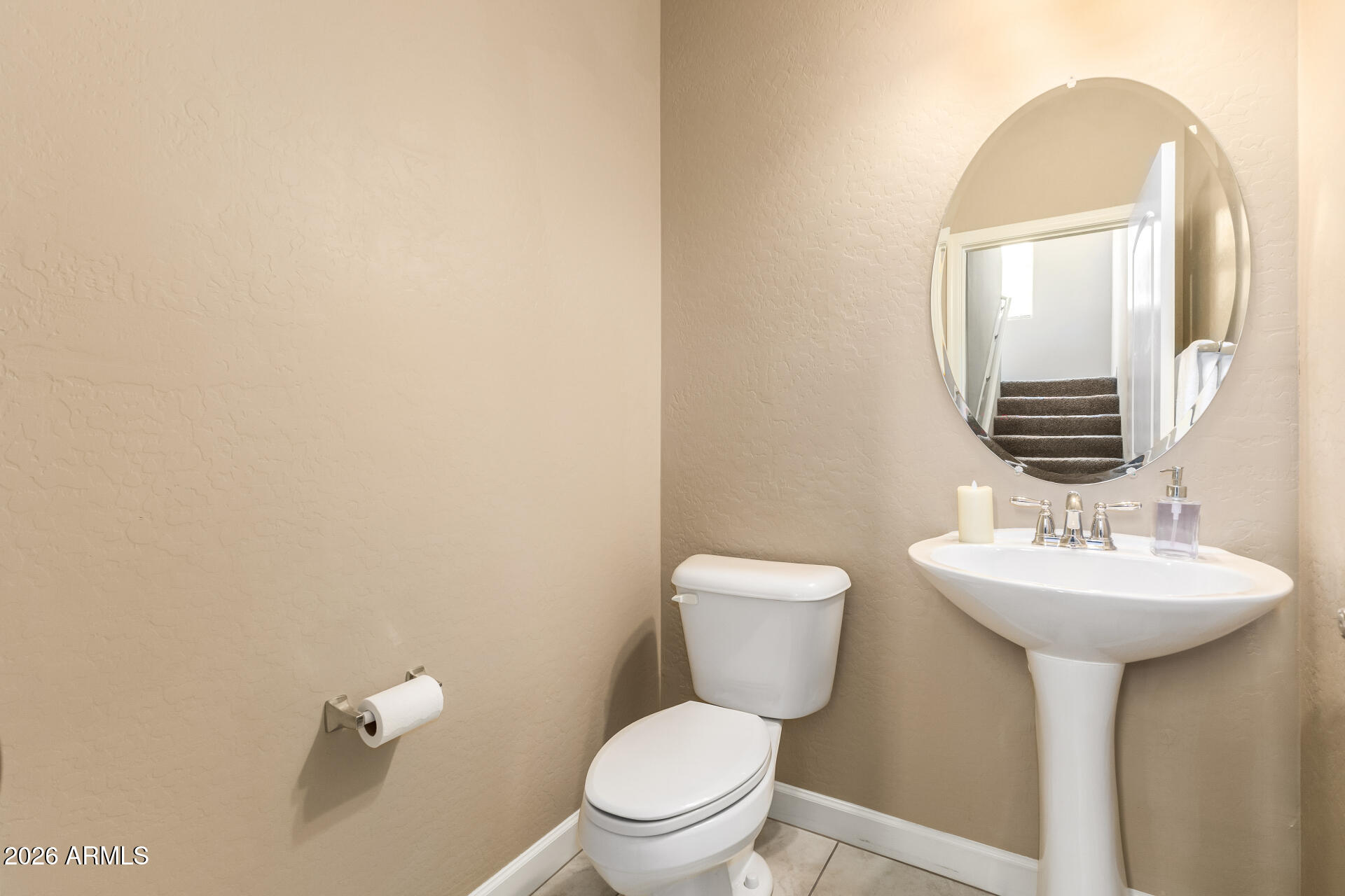 2150 West Alameda Road, Unit 1181 Phoenix, AZ 85085 - Photo 12 of 46 a bathroom with a toilet sink and mirror