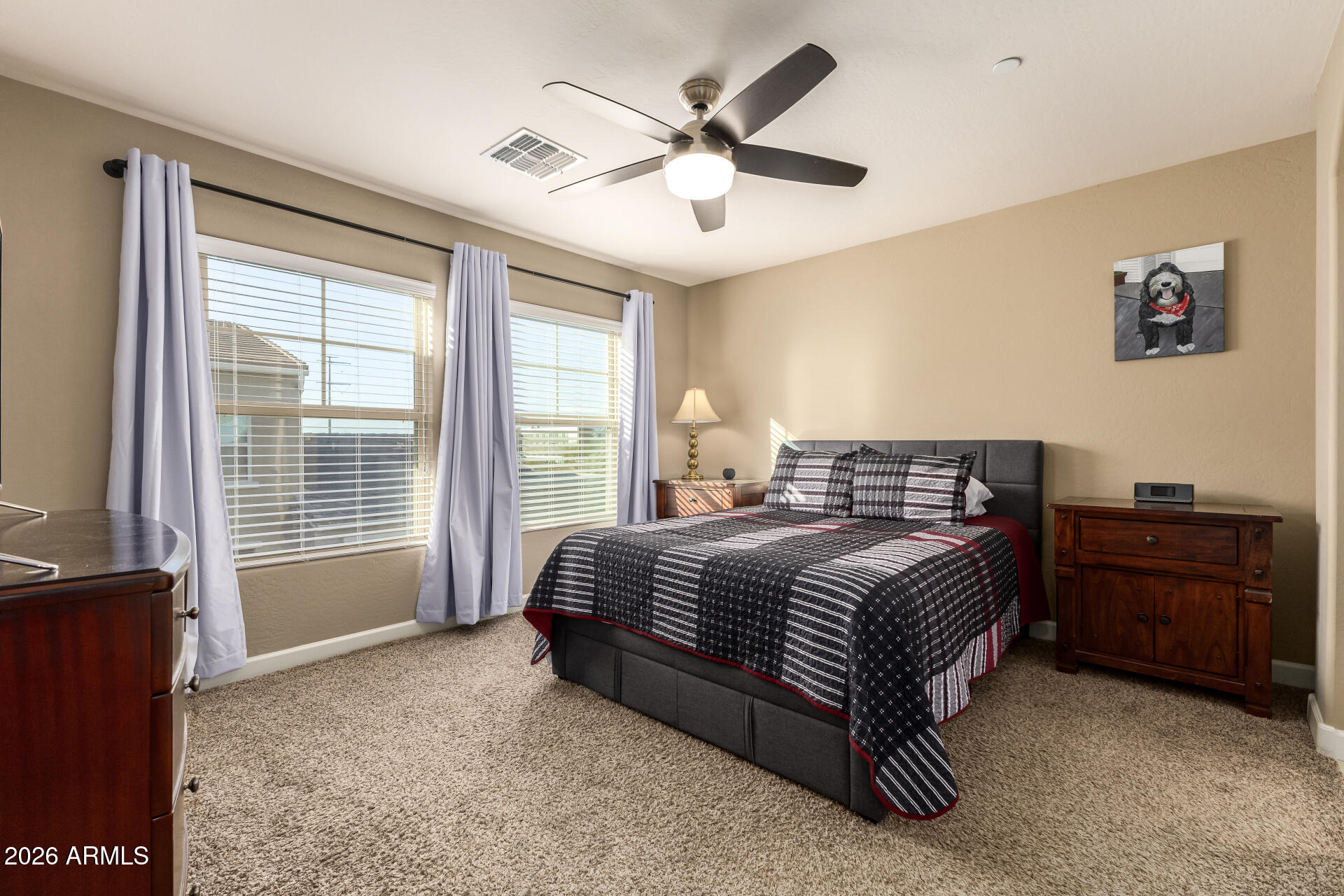 2150 West Alameda Road, Unit 1181 Phoenix, AZ 85085 - Photo 13 of 46 a spacious bedroom with a bed and a dresser