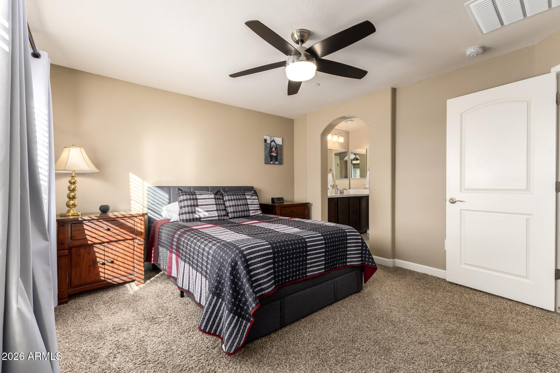 2150 West Alameda Road, Unit 1181 Phoenix, AZ 85085 - Photo 14 of 46 a bedroom with a bed chandelier and a window