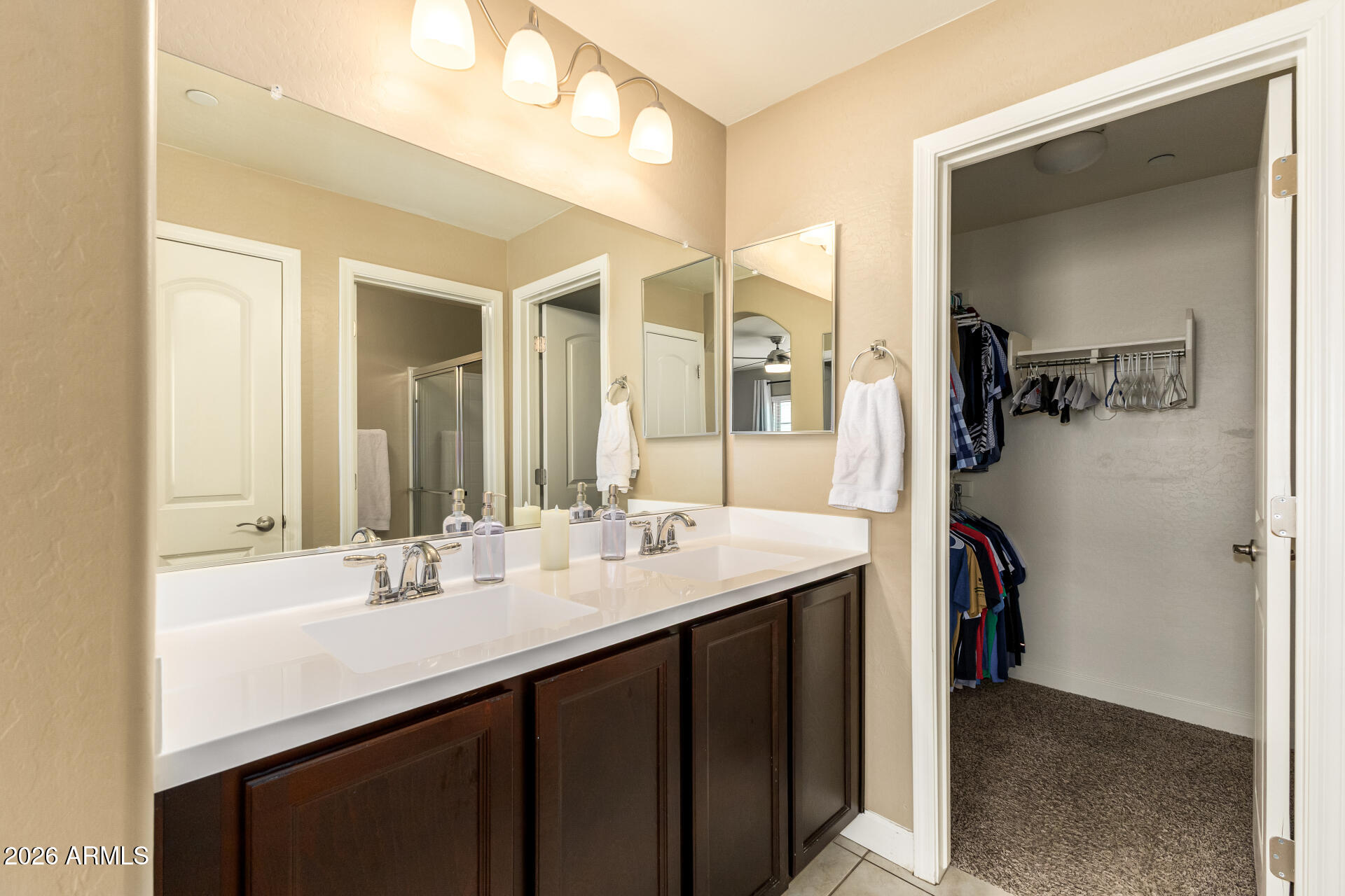2150 West Alameda Road, Unit 1181 Phoenix, AZ 85085 - Photo 15 of 46 a en suite bathroom with a double vanity sink and mirror