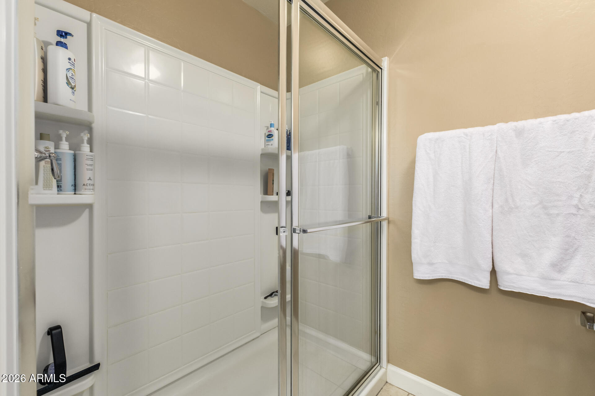 2150 West Alameda Road, Unit 1181 Phoenix, AZ 85085 - Photo 16 of 46 a bathroom with a shower and a glass door