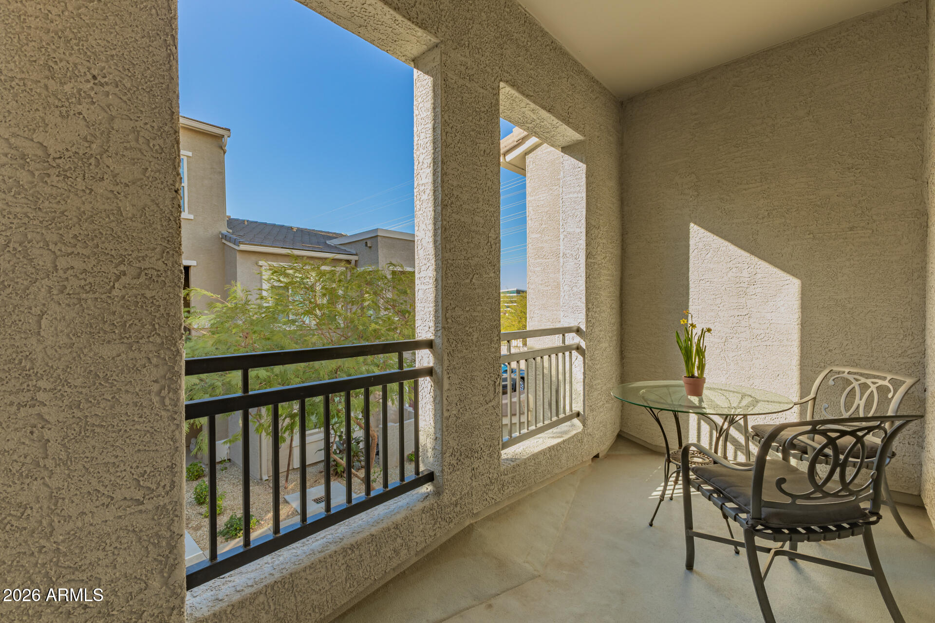 2150 West Alameda Road, Unit 1181 Phoenix, AZ 85085 - Photo 29 of 46 a view of a balcony with chairs