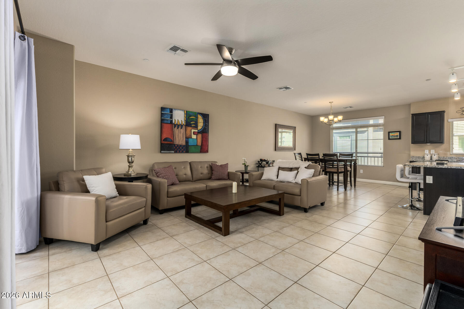2150 West Alameda Road, Unit 1181 Phoenix, AZ 85085 - Photo 2 of 46 a living room with furniture and a view of kitchen