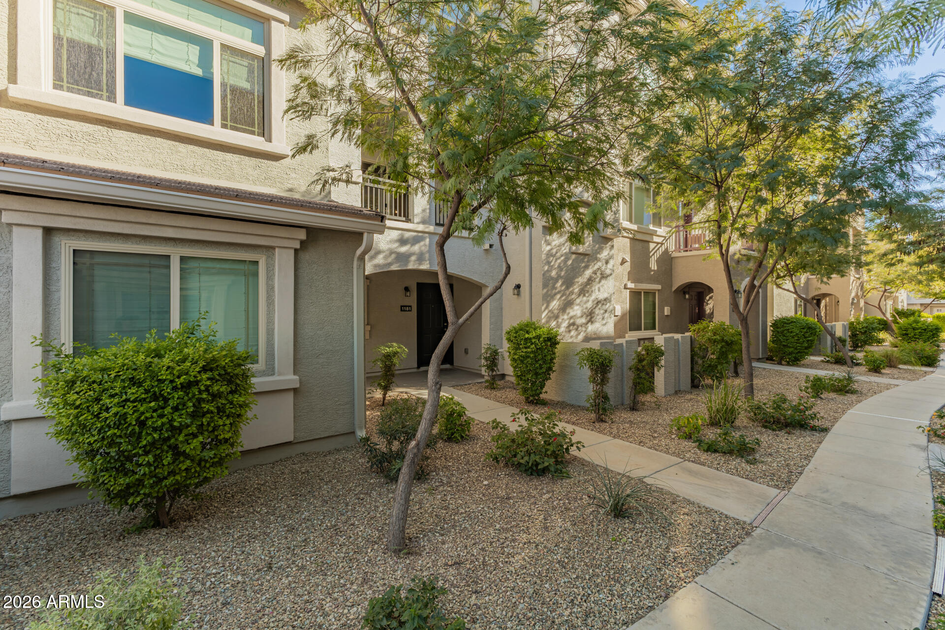 2150 West Alameda Road, Unit 1181 Phoenix, AZ 85085 - Photo 31 of 46 front view of a house with a yard