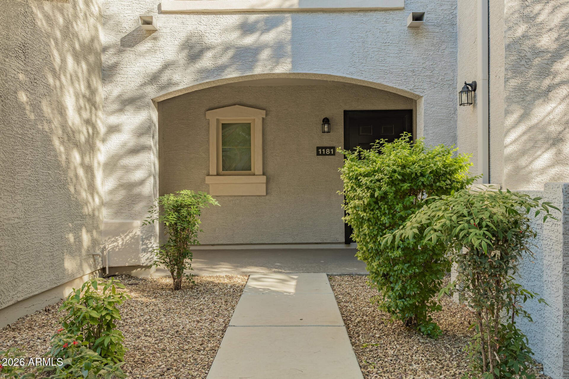 2150 West Alameda Road, Unit 1181 Phoenix, AZ 85085 - Photo 32 of 46 a front view of a house with garden