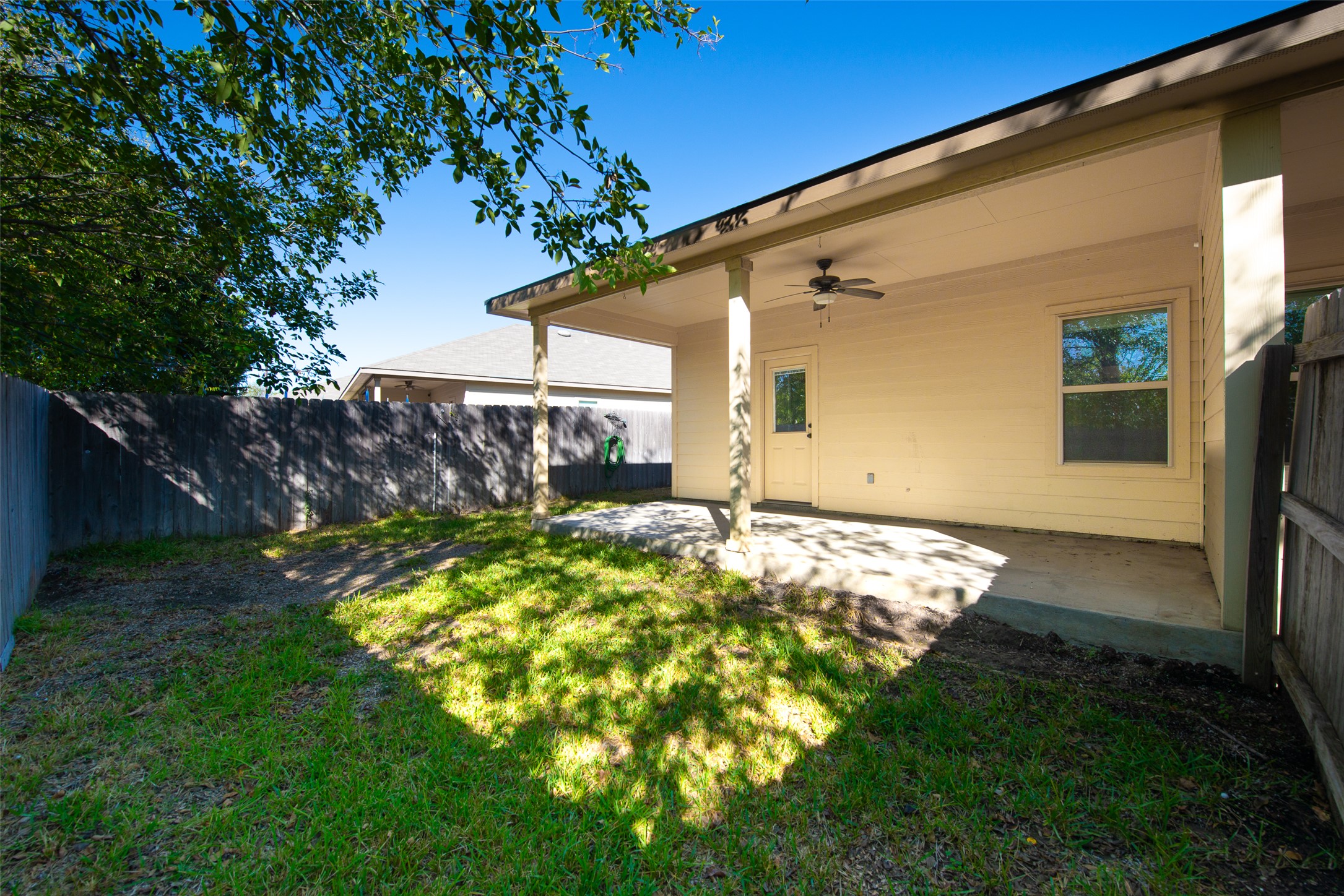 245 Joanne Loop, Unit B Buda, TX 78610 - Photo 31 of 33 Back yard facing towards patio