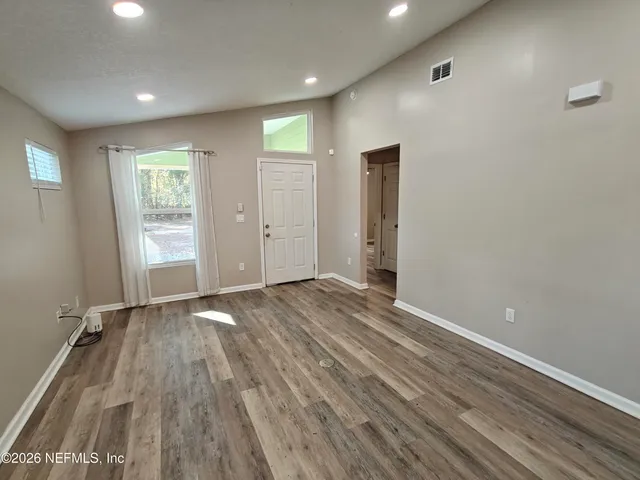 a kitchen with stainless steel appliances granite countertop wooden cabinets a stove top oven a sink and dishwasher