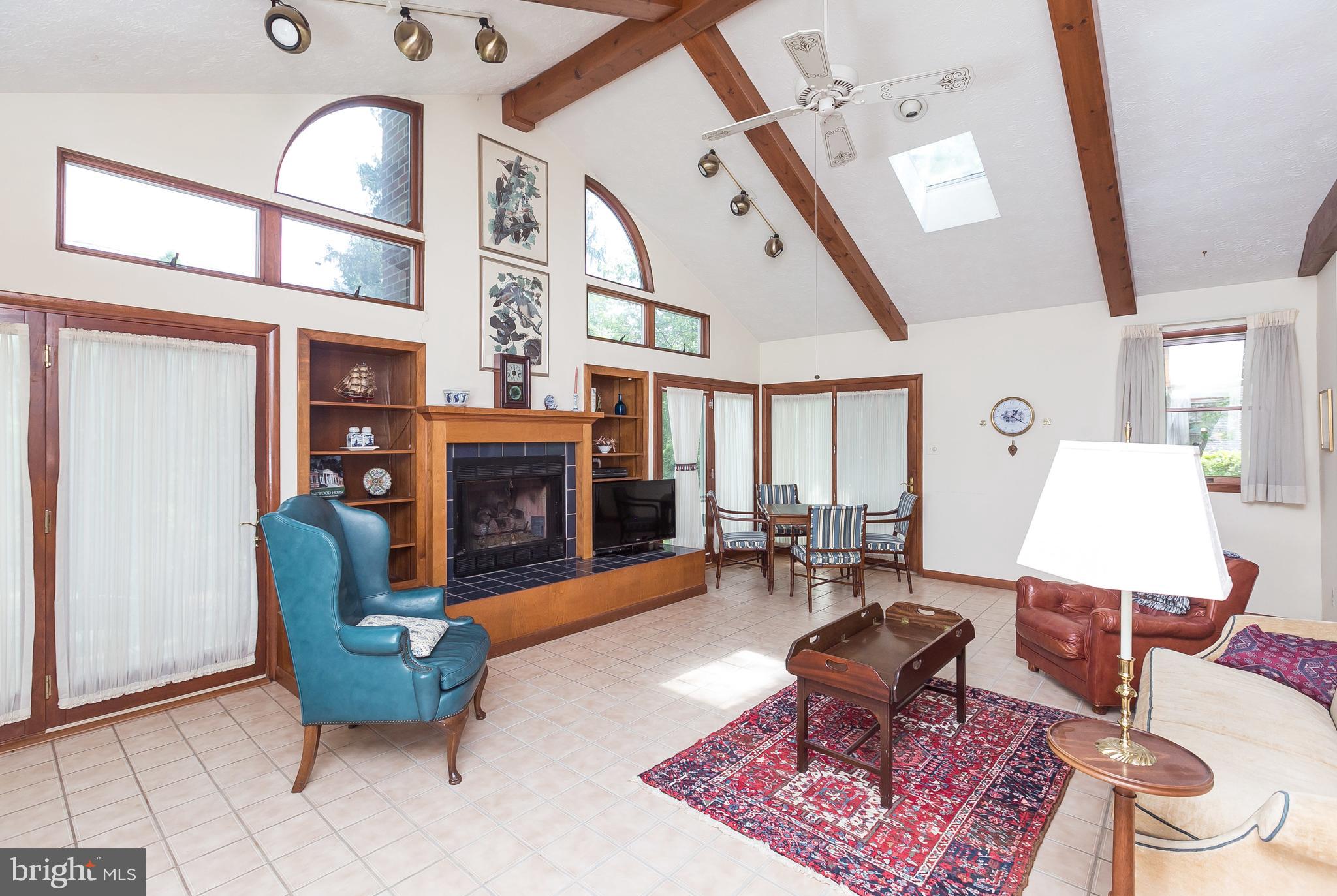 8203 Burnley Road Baltimore, MD 21204 - Photo 16 of 40 Family room with fireplace and vaulted ceilings