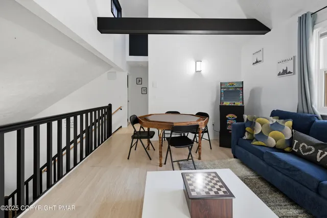 a view of a livingroom with furniture and a couch