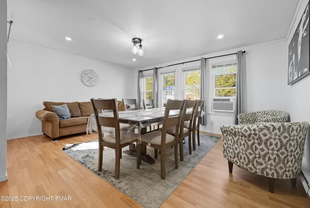 a view of a dining room with furniture window and outside view