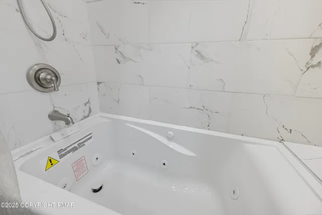 a bathroom with a bathtub