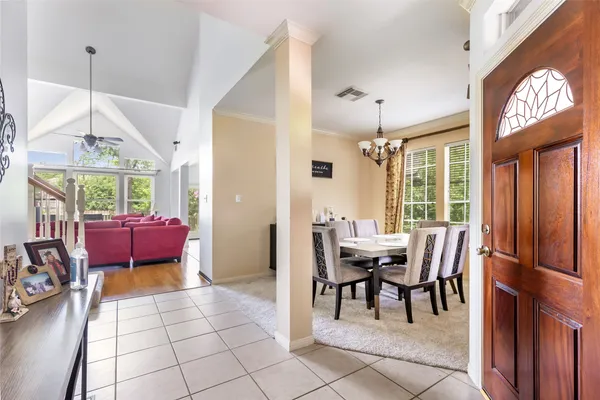 a dining room with furniture and window