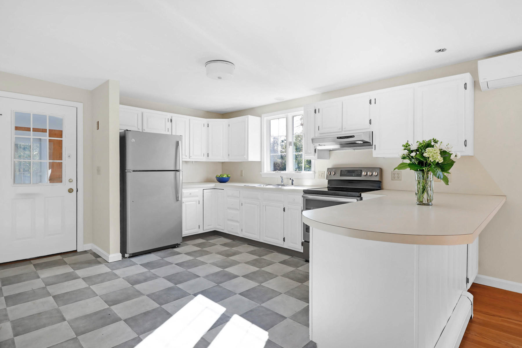 21 Briar Spring Road Orleans, MA 02653 - Photo 11 of 65 a kitchen with stainless steel appliances a refrigerator sink and white cabinets
