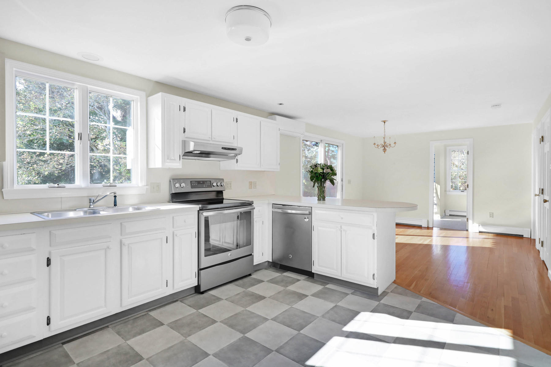 21 Briar Spring Road Orleans, MA 02653 - Photo 12 of 65 a kitchen with granite countertop white cabinets and white appliances