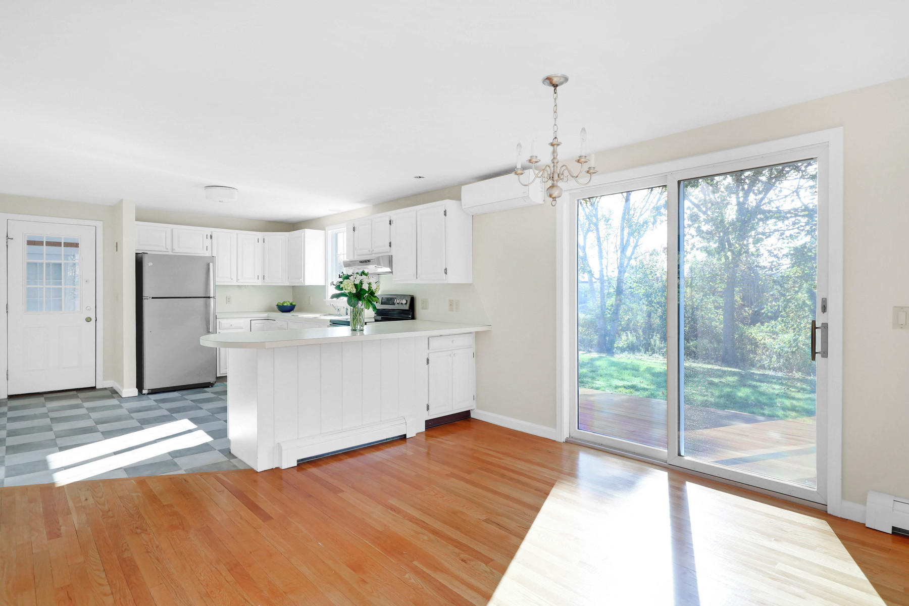 21 Briar Spring Road Orleans, MA 02653 - Photo 15 of 65 a view of a kitchen with refrigerator and windows