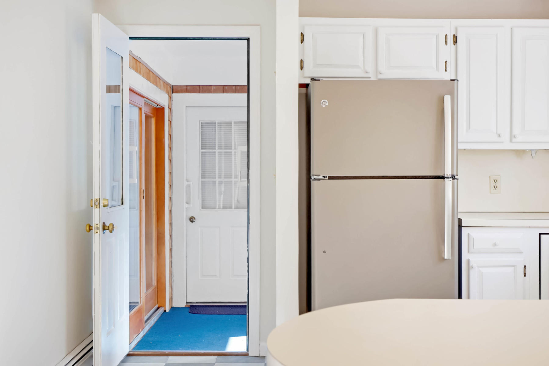21 Briar Spring Road Orleans, MA 02653 - Photo 16 of 65 a white refrigerator freezer sitting inside of a kitchen