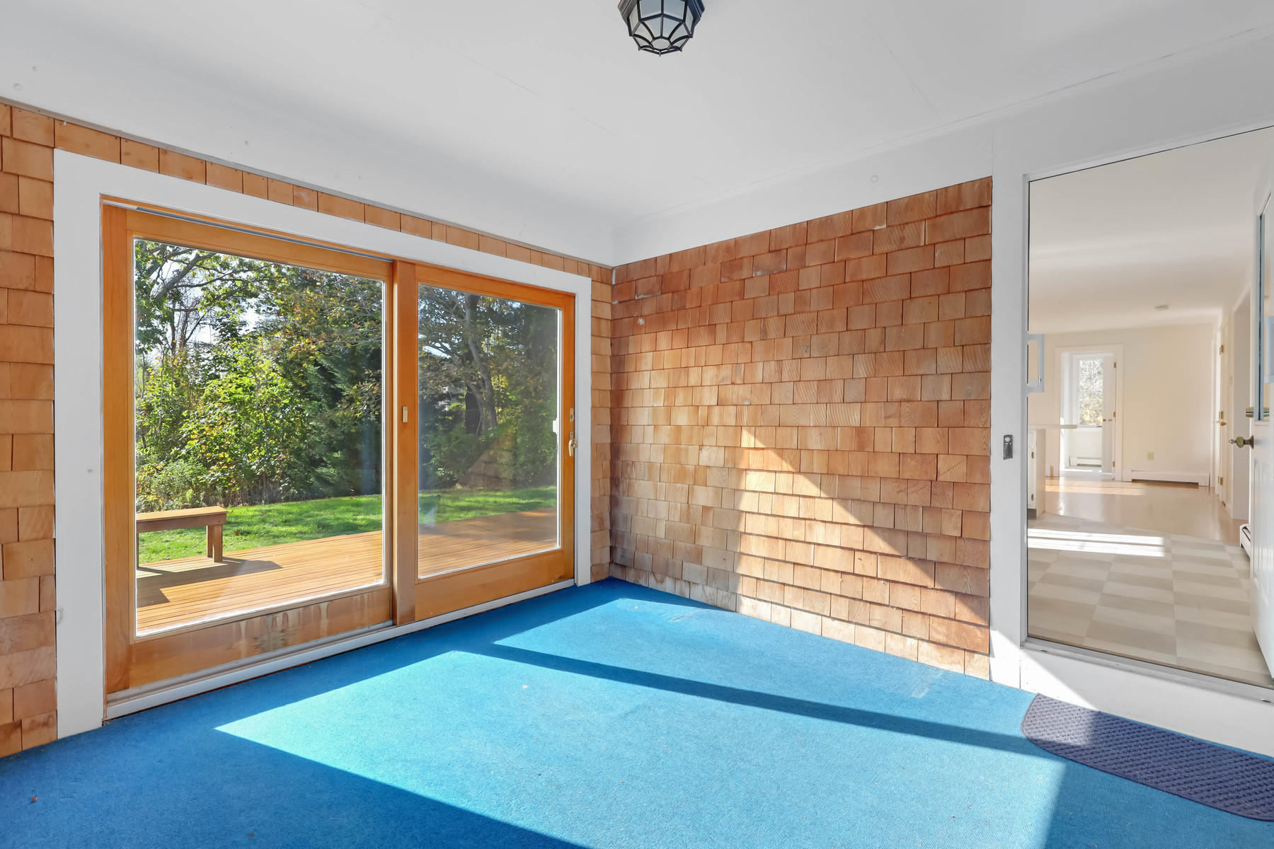 21 Briar Spring Road Orleans, MA 02653 - Photo 17 of 65 a view of empty room with wooden floor and windows