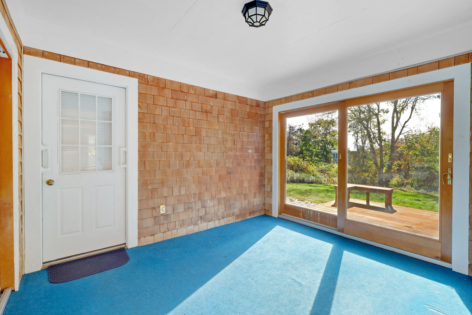 21 Briar Spring Road Orleans, MA 02653 - Photo 18 of 65 wooden floor in an empty room with a window