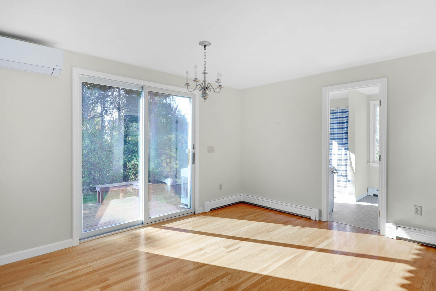 21 Briar Spring Road Orleans, MA 02653 - Photo 20 of 65 a view of an empty room with wooden floor and a window