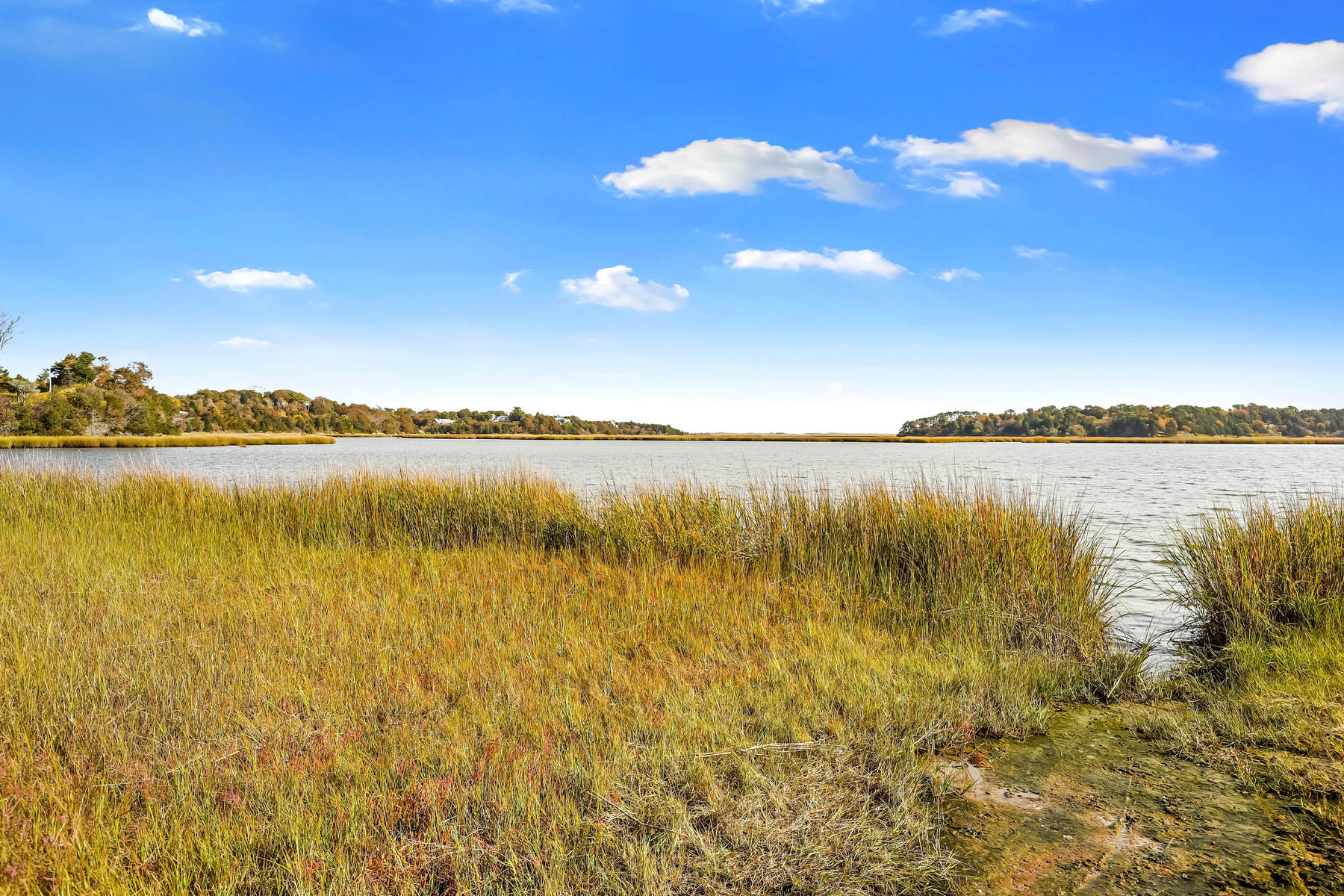 21 Briar Spring Road Orleans, MA 02653 - Photo 46 of 65 a view of a lake with a city