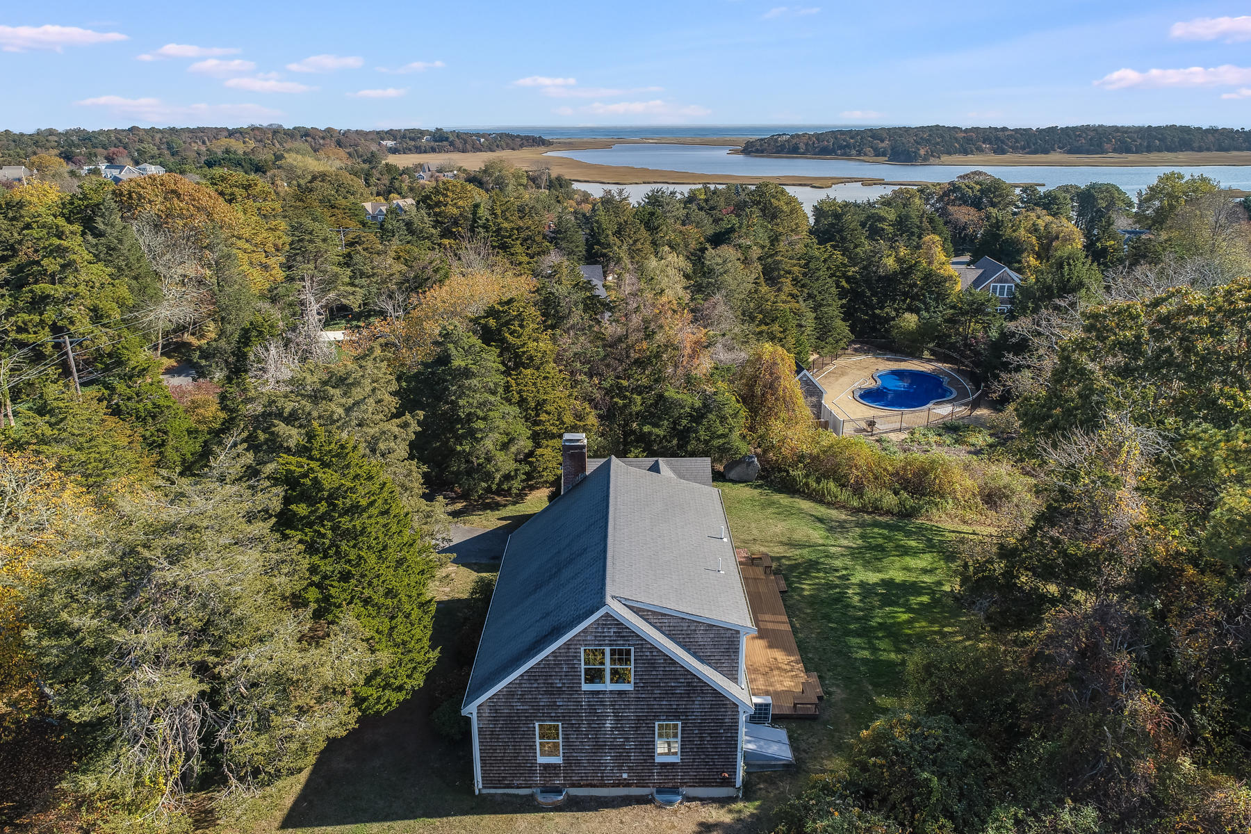 21 Briar Spring Road Orleans, MA 02653 - Photo 54 of 65 a aerial view of a house with a yard and lake view