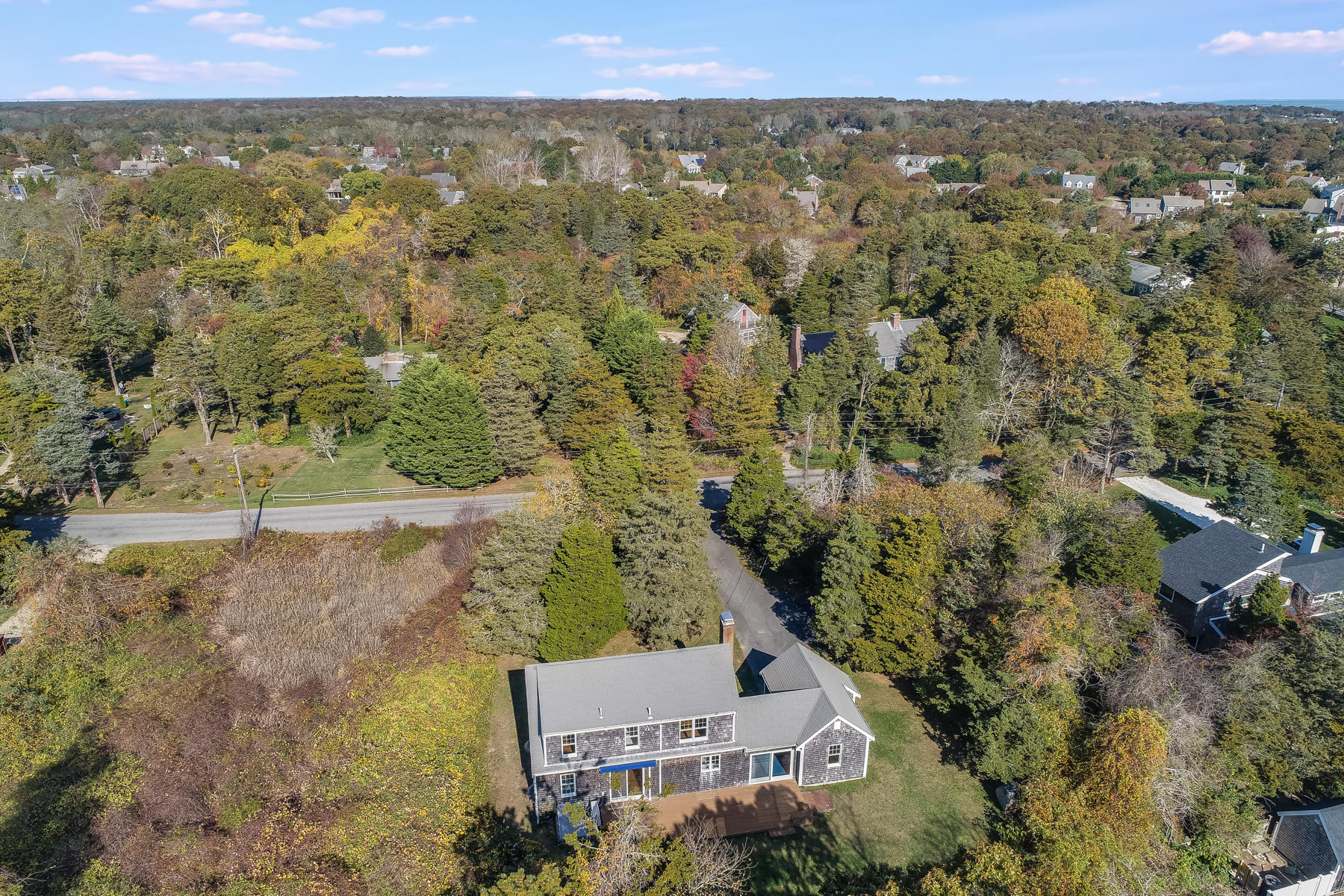 21 Briar Spring Road Orleans, MA 02653 - Photo 60 of 65 an aerial view of a house with a yard