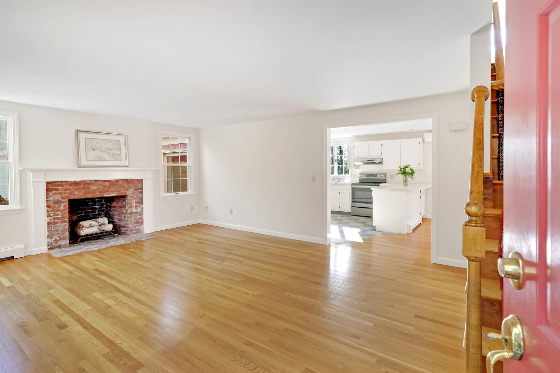 21 Briar Spring Road Orleans, MA 02653 - Photo 6 of 65 a view of an empty room with wooden floor and a fireplace