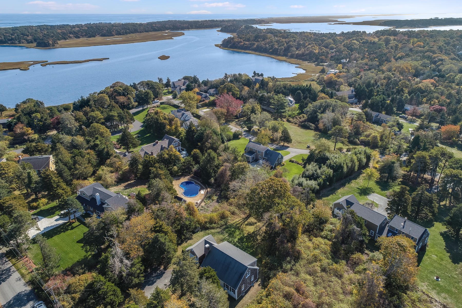 21 Briar Spring Road Orleans, MA 02653 - Photo 62 of 65 an aerial view of a houses with a lake