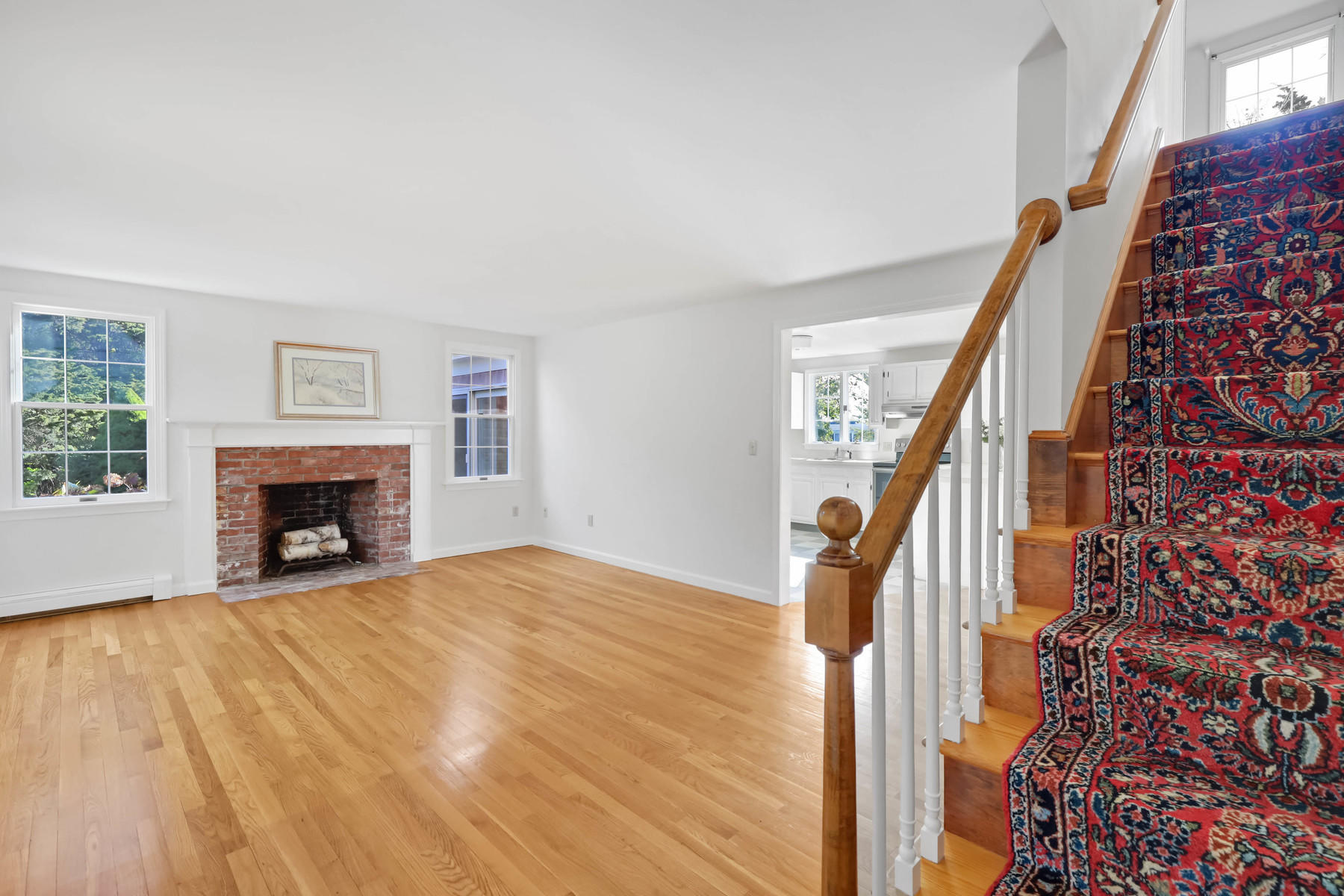 21 Briar Spring Road Orleans, MA 02653 - Photo 7 of 65 a view of an empty room with wooden floor and a window