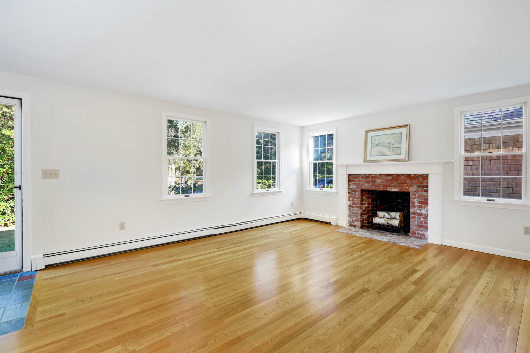 21 Briar Spring Road Orleans, MA 02653 - Photo 8 of 65 an empty room with windows and fireplace