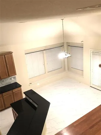 a view of a glass door and a yard