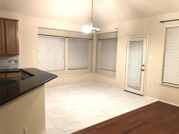 a view of a kitchen with a sink and dishwasher