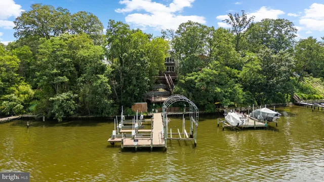 a view of a lake with boats and trees