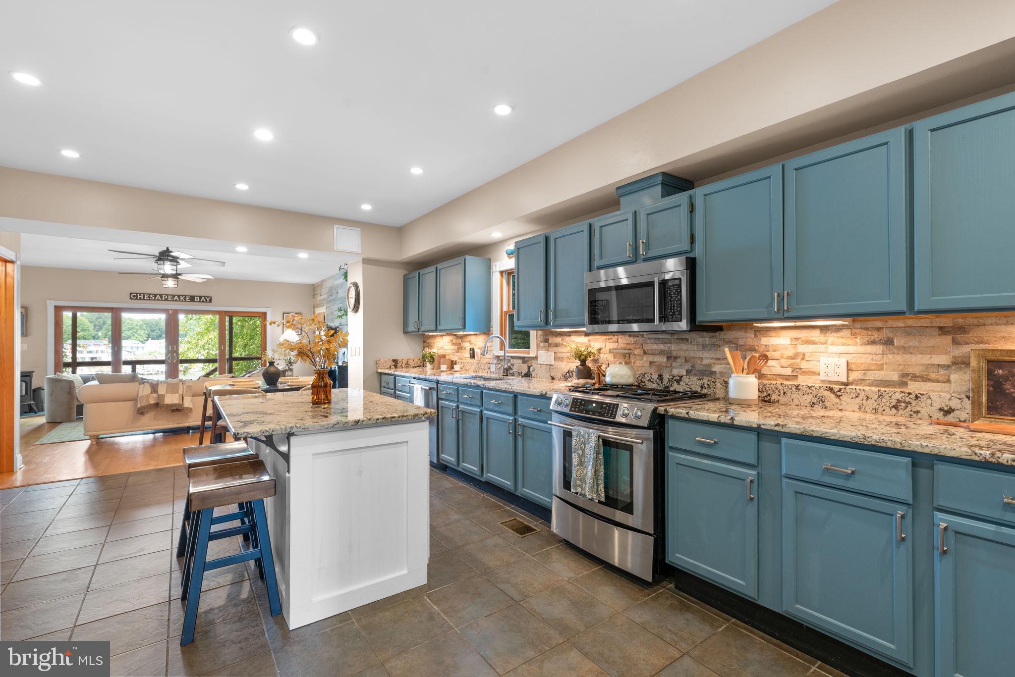 7674 Pine Knob Road Pasadena, MD 21122 - Photo 11 of 59 a kitchen with lots of counter top space and appliances