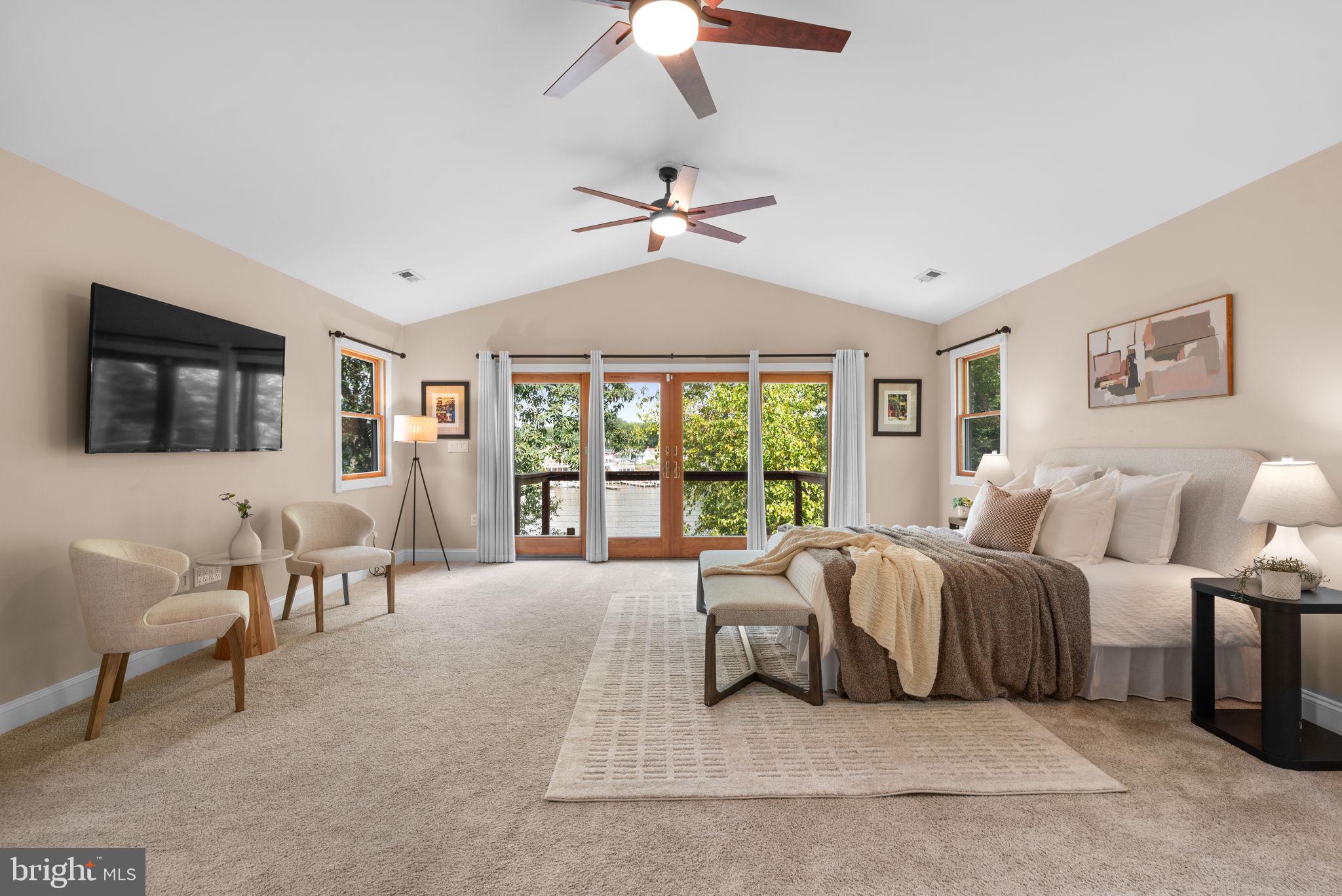 7674 Pine Knob Road Pasadena, MD 21122 - Photo 20 of 59 a living room with a balcony furniture and a chandelier
