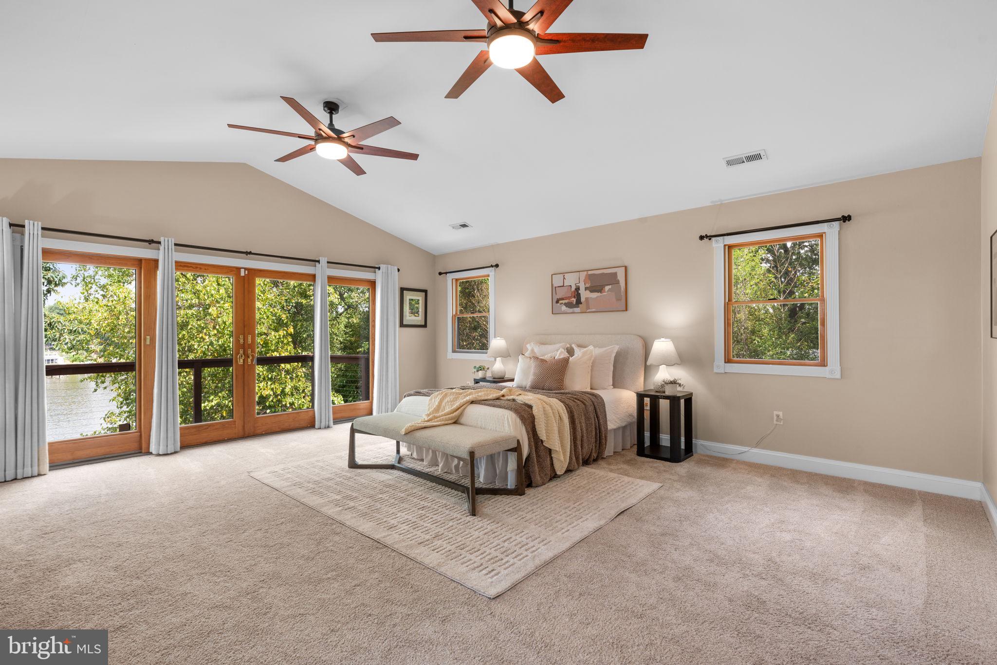 7674 Pine Knob Road Pasadena, MD 21122 - Photo 21 of 59 a spacious bedroom with a bed and a large window