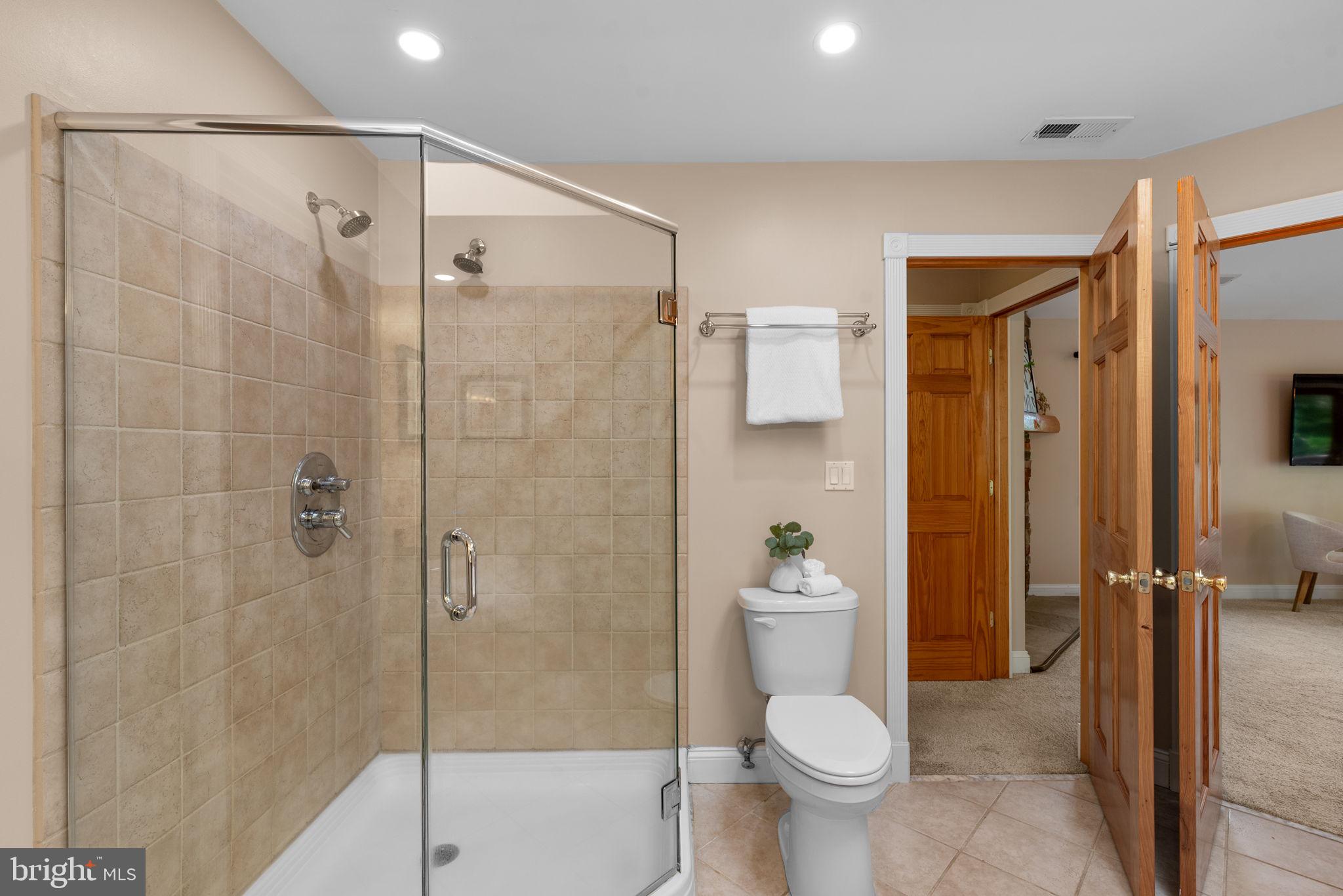 7674 Pine Knob Road Pasadena, MD 21122 - Photo 33 of 59 a bathroom with a toilet and a shower