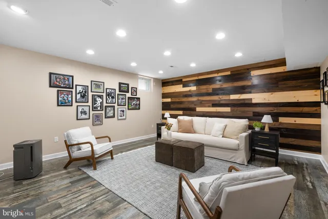 a view of a patio with table and chairs wooden floor and fence