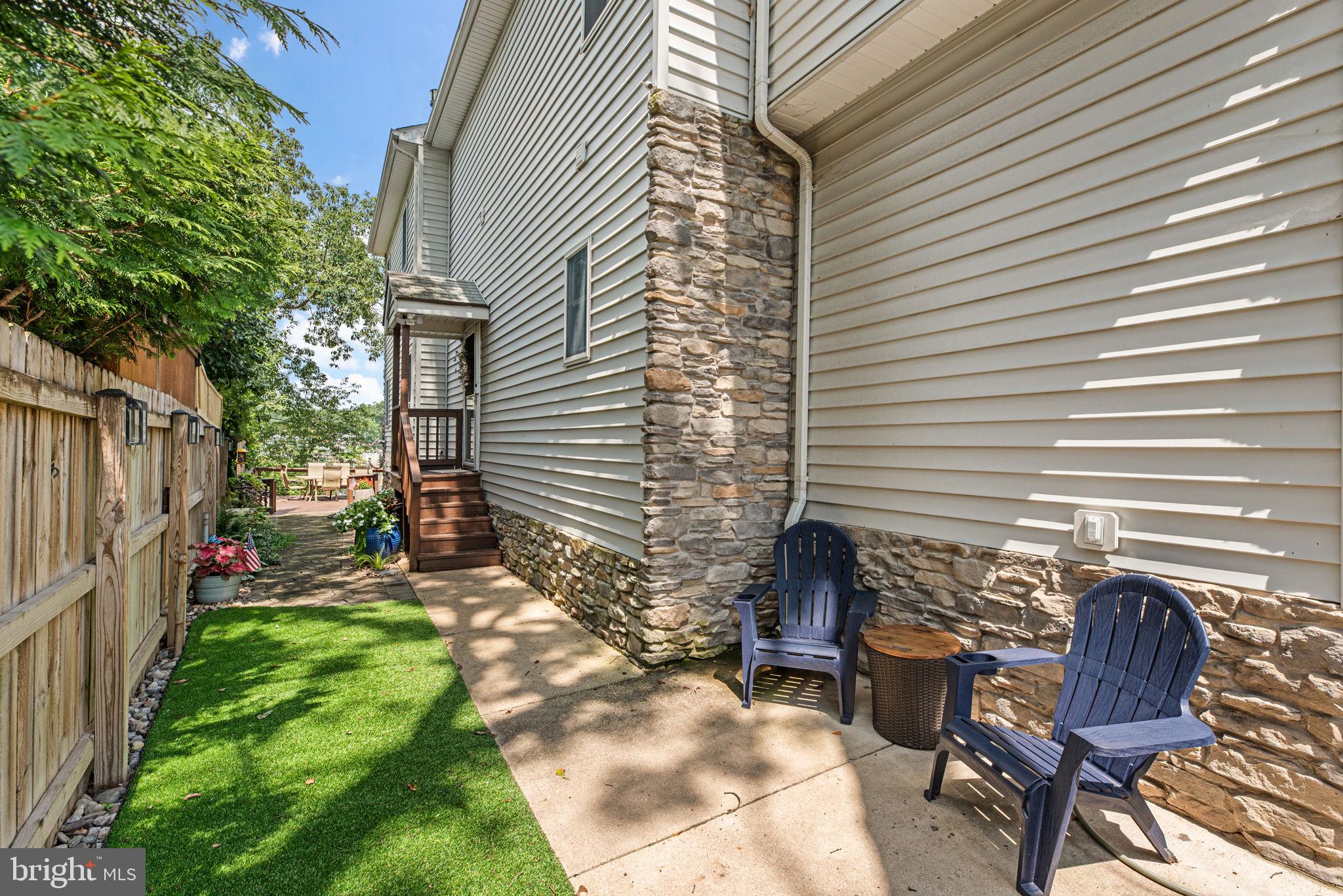 7674 Pine Knob Road Pasadena, MD 21122 - Photo 4 of 59 a backyard of a house with outdoor seating