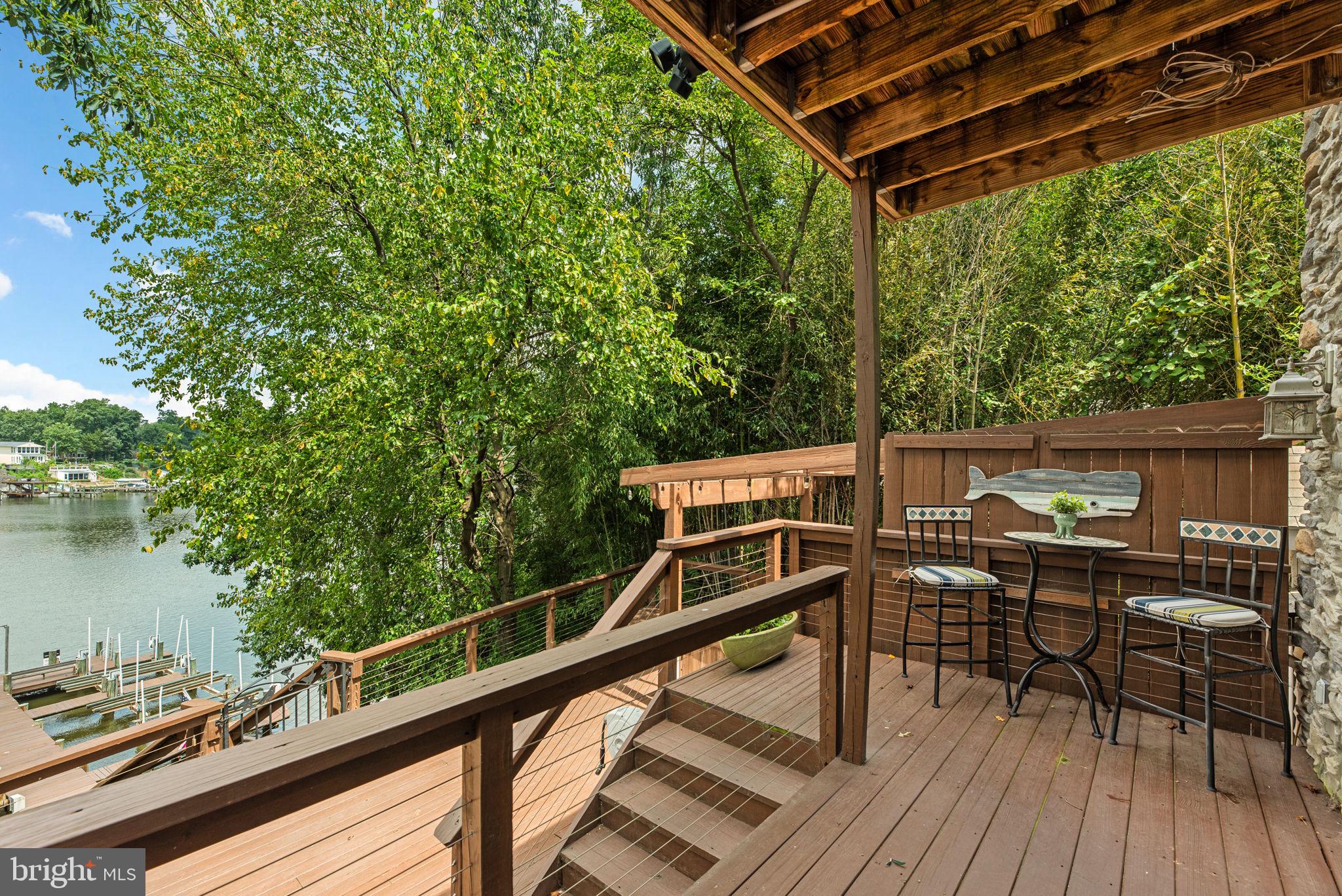 7674 Pine Knob Road Pasadena, MD 21122 - Photo 41 of 59 a view of a balcony with chairs