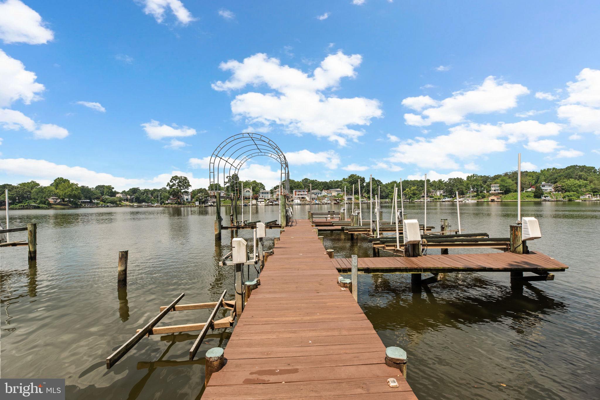 7674 Pine Knob Road Pasadena, MD 21122 - Photo 46 of 59 a view of a lake with sitting area