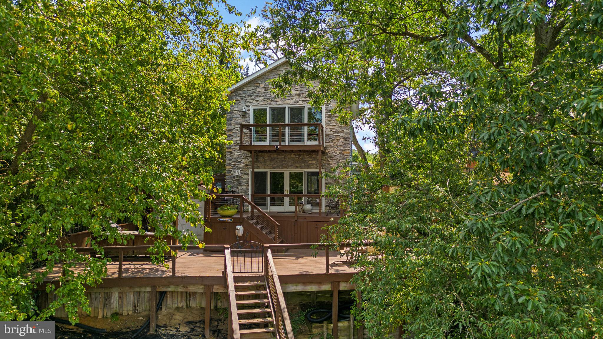 7674 Pine Knob Road Pasadena, MD 21122 - Photo 47 of 59 a front view of a house with a yard