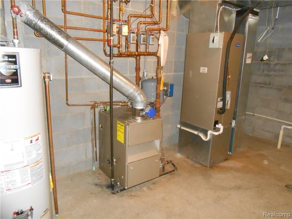 10405 North Rushton Road North South Lyon, MI 48178 - Photo 20 of 28 Furnace and Hot Water Heater in basement
