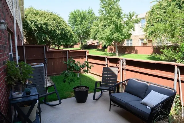 a view of a patio with couches chairs and potted plants
