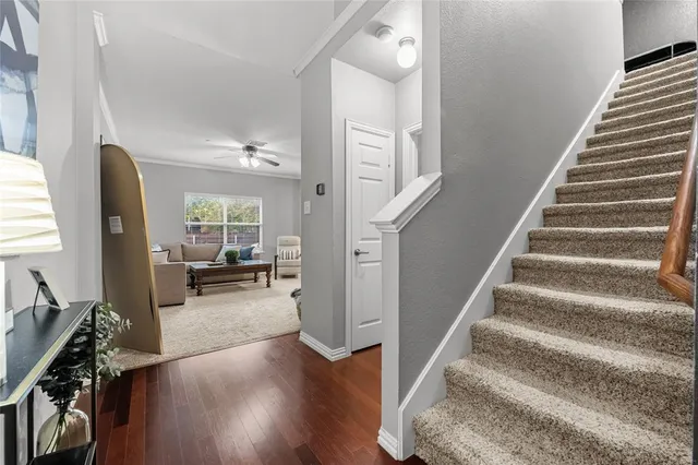 a view of entryway and hall with wooden floor