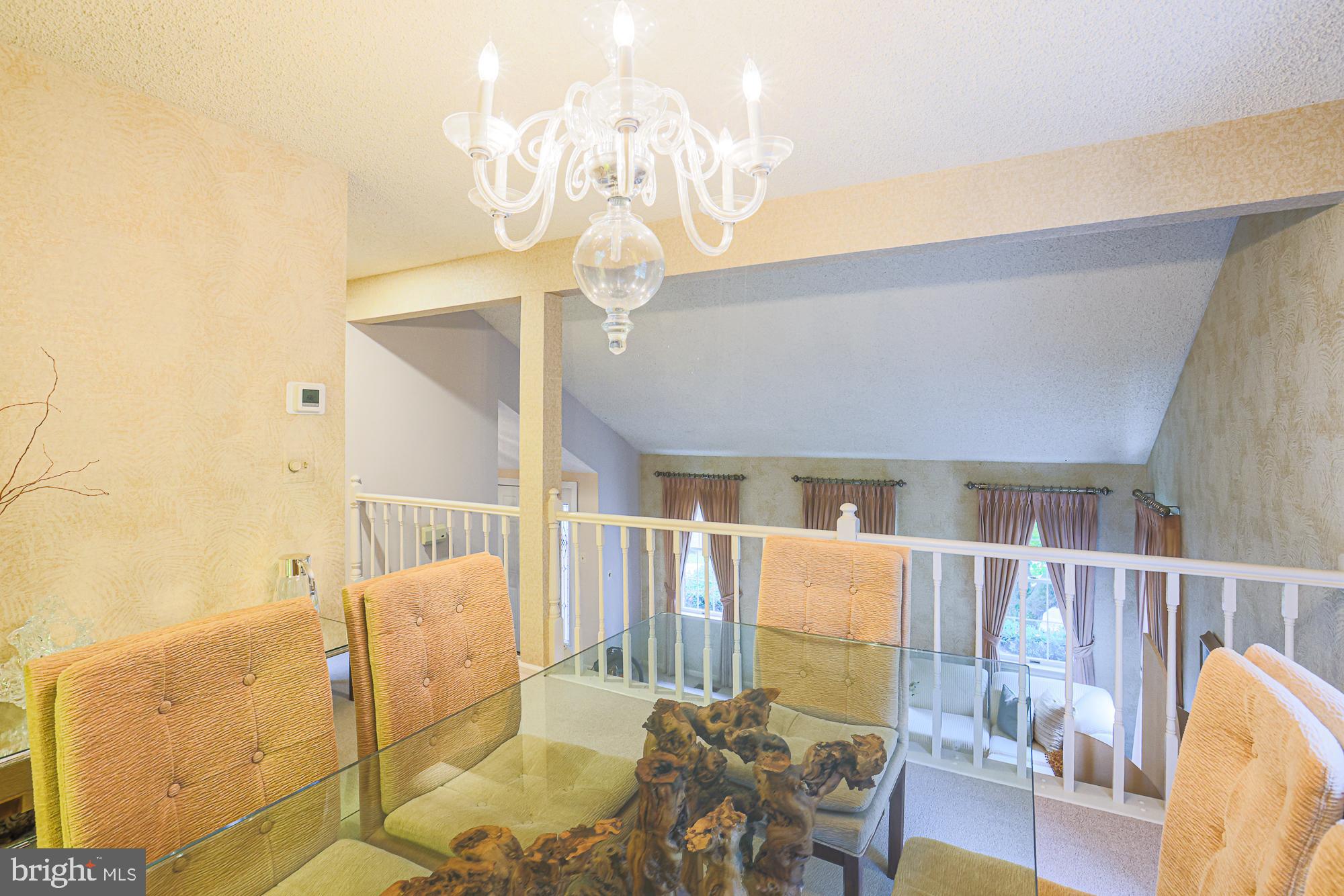 260 Hunters Ridge Road Lutherville-Timonium, MD 21093 - Photo 11 of 48 a living room with furniture and a chandelier