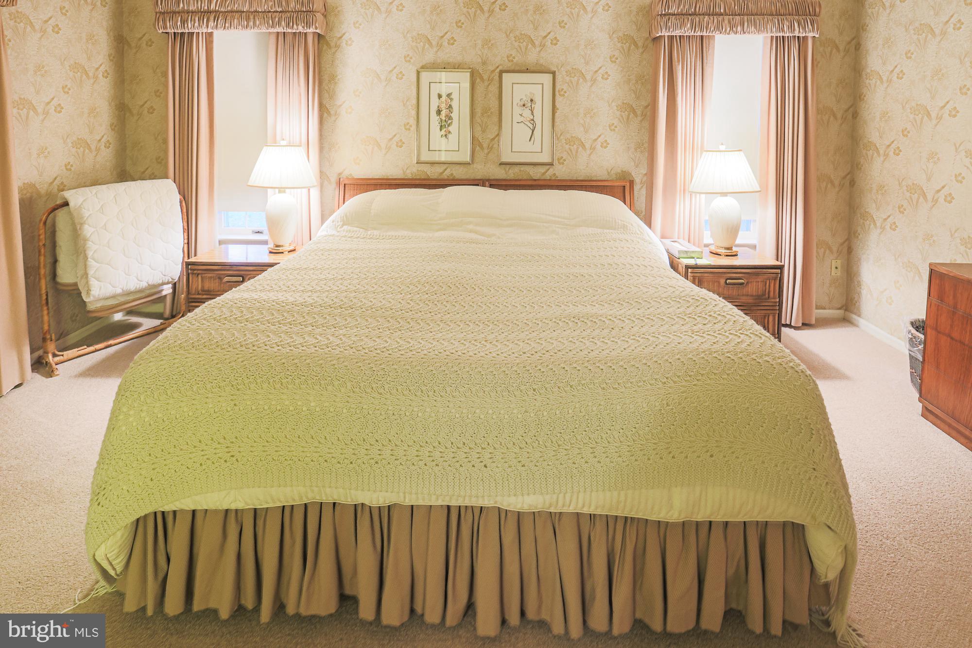 260 Hunters Ridge Road Lutherville-Timonium, MD 21093 - Photo 25 of 48 a large bed sitting in a bedroom next to a window