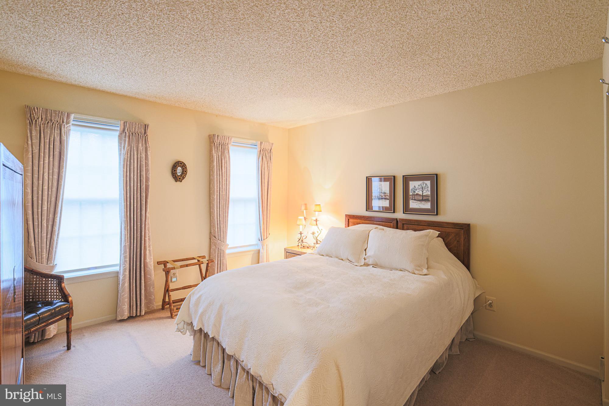 260 Hunters Ridge Road Lutherville-Timonium, MD 21093 - Photo 32 of 48 a bedroom with a large bed and a window