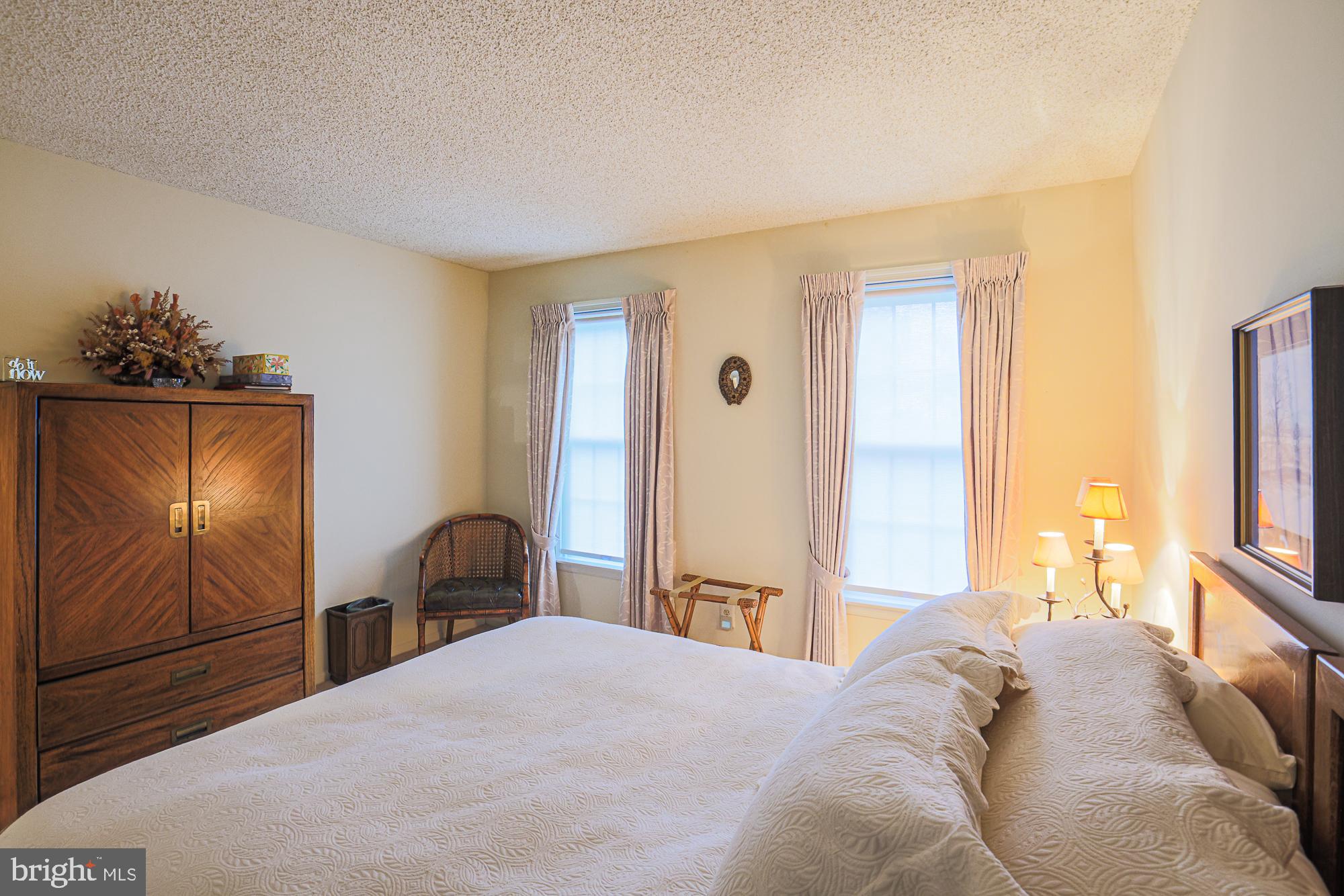 260 Hunters Ridge Road Lutherville-Timonium, MD 21093 - Photo 33 of 48 a bedroom with a bed and a dresser with chair