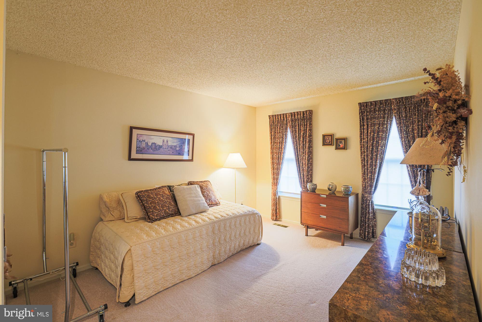 260 Hunters Ridge Road Lutherville-Timonium, MD 21093 - Photo 35 of 48 a bedroom with a bed and wooden floor